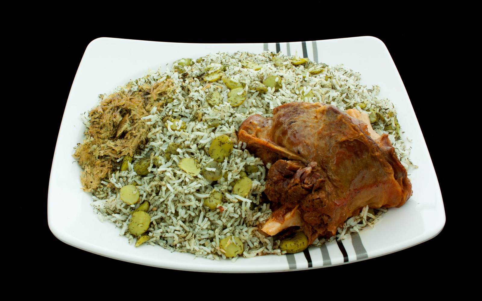 Luxury plating of Baghali Polo with Lamb Shank